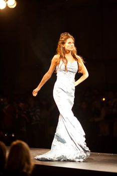 PRAGUE-SEPTEMBER 24: A model walks the runway during the 2011 autumn/winter Nina Ricci Paris Collection by Obsession during the Prague Fashion Weekend on September 24, 2011 in Prague, Czech Republic.