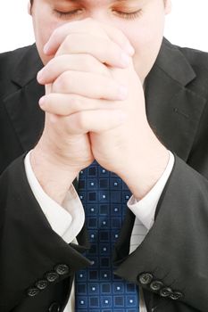 portrait of businessman praying for success