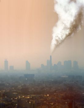 a view of atmospheric air pollution from factory