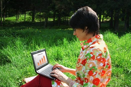 Young woman working in the park