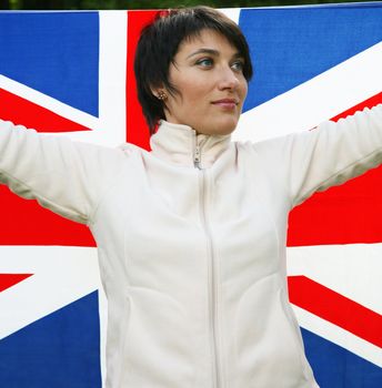 Young woman holding flag of Great Britain
