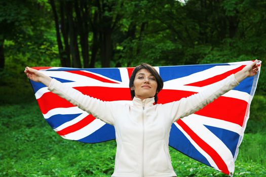 Young woman holding flag of Great Britain