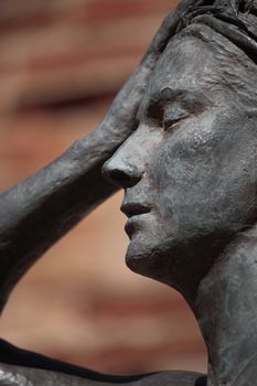 Face of an ancient roman staute of a woman