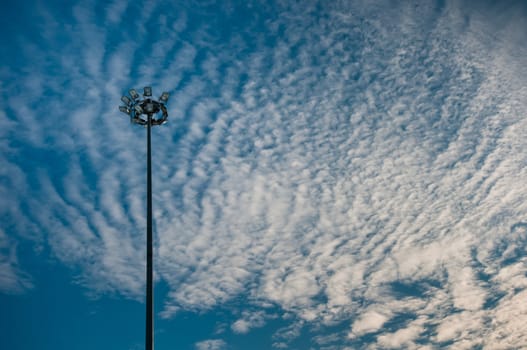 Modern high lantern with beautiful cloudscape background on sunset