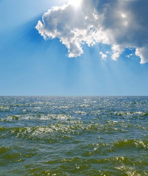 cloudy sky over sea with green tone