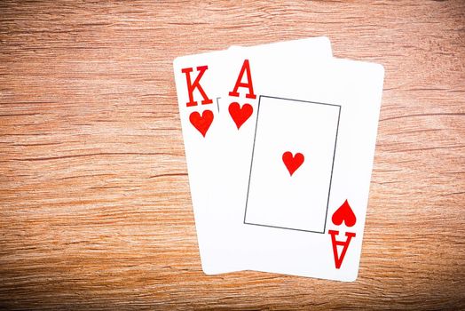 playing cards on a wooden background