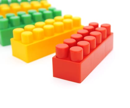 multicolored toy blocks isolated on a white background