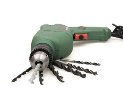 Green drill and replaceable drills isolated on a white background