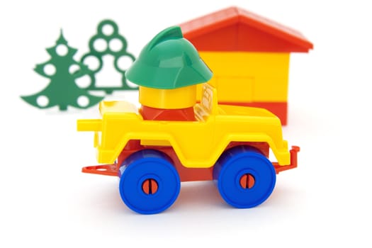 Bright toy car house and tree on a white background