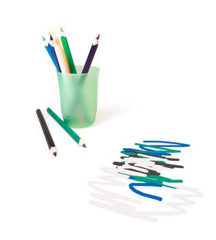 Color pencils for drawing in a glass on a white background