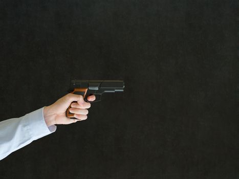 Business man, student or teacher pointing a gun with copy space