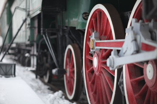 The wheels of the old steam locomotive, a fragment, close-up