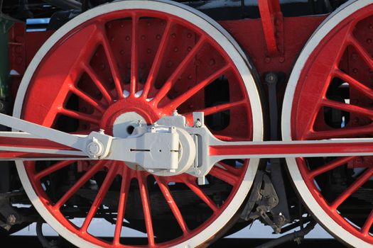 The wheels of the old steam locomotive, a fragment, close-up