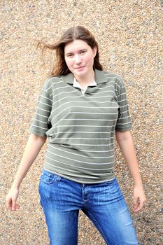 Female tomboy posing outside.