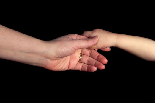 Mother Holding Daughters Hand Isolated on Black