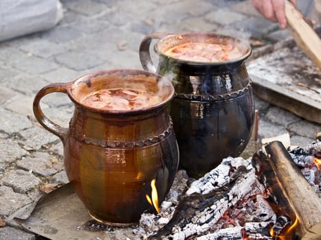 cooking in the ceramic jar on the fire