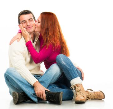 Beautiful Young happy couple kissing on white background
