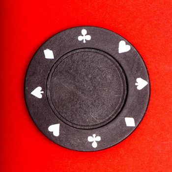 black chip for poker on table