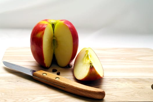 Apple being cut for eating