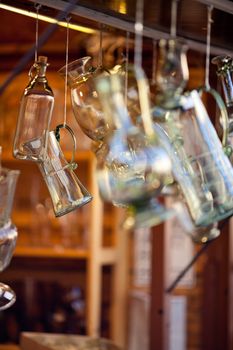 decanters of bohemian glass hanging on hooks