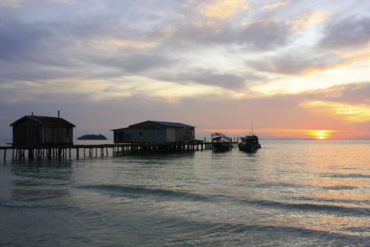 Silhouette of wooden jetty at sunrise, Koh Rong island, Cambodia, Southeast Asia