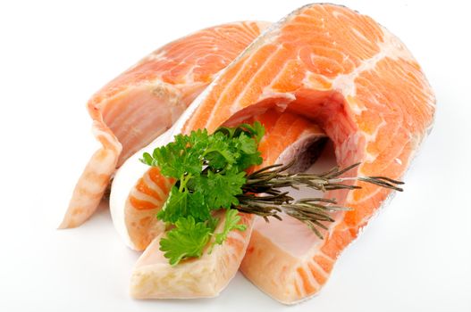 Fresh steak of trout with parsley and rosemary isolared on white background
