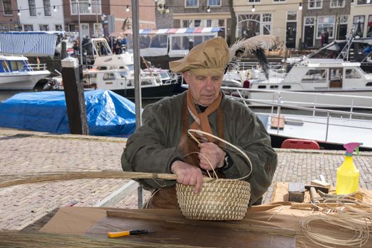 BRIELLE,HOLLAND APRIL 01:male braid cane basket on the market on April 01,2013 in Brielle,Holland.This is the party of the the uprising of Low Countries against Spain in the 80 Years' War