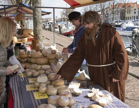 BRIELLE,HOLLAND APRIL 01:people buy cheese on the market on April 01,2013 in Brielle,Holland.This is the party of the the uprising of Low Countries against Spain in the 80 Years' War