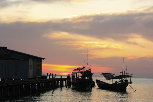 Silhouette of traditional fishing boat at sunrise, Koh Rong island, Cambodia, Southeast Asia