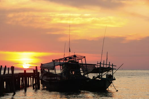 Silhouette of traditional fishing boat at sunrise, Koh Rong island, Cambodia, Southeast Asia