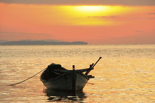 Silhouette of traditional fishing boat at sunrise, Koh Rong island, Cambodia, Southeast Asia