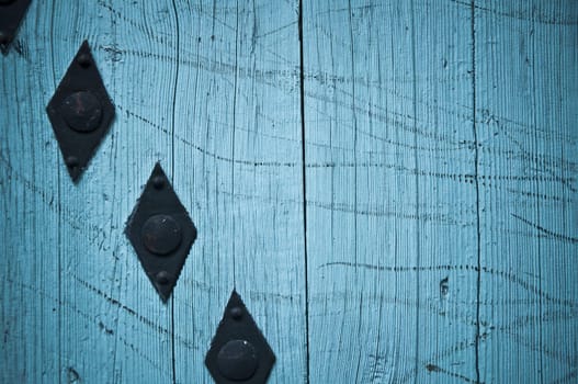 Blue texture with metal ornaments of an old Turkish door