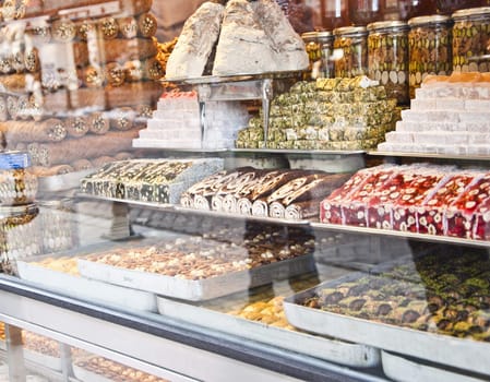 various Turkish sweets and desserts seen from outside of the shop