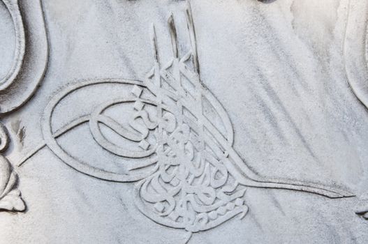 Close up of a marble carving with Ottoman Tughra