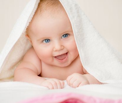 beautiful baby with a towel