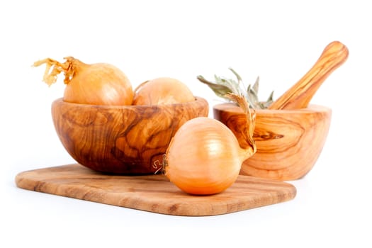 Fresh bulbs of onion on a white background