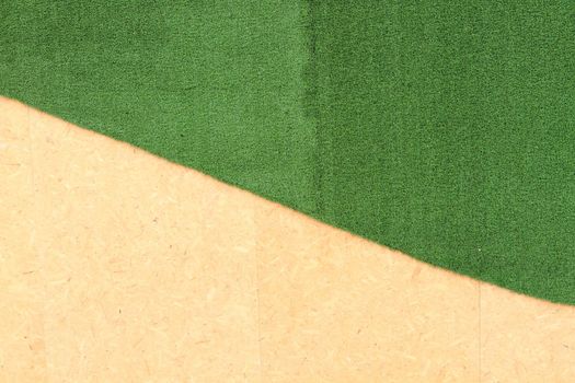 Wood on Artificial turf green background