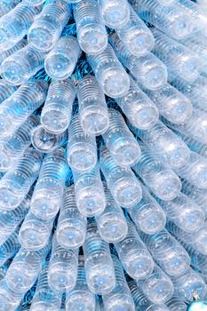 rows of empty plastic bottles at bottling plant