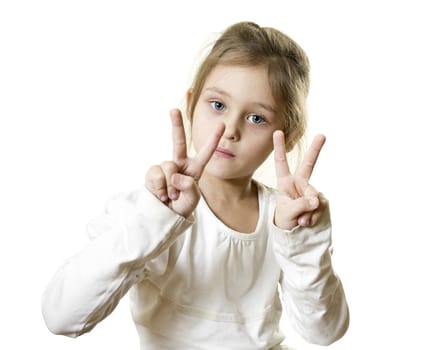cute little girl with blue eyes shows two fingers