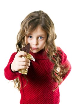 cute little girl with long arms holding in his outstretched hand  chocolate bar
