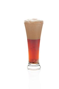 dark beer with the foam in a tall glass isolated on white