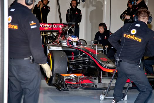 JEREZ DE LA FRONTERA, SPAIN - FEB 07: Jenson Button of McLaren F1 waiting in pit on training session on February 07 , 2012, in Jerez de la Frontera , Spain