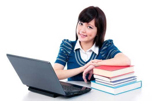 Portrait of an attractive Asian female student with laptop and books.