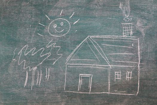 House under the sun drawn in chalk on a blackboard