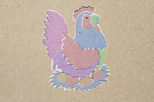 recycled paper craft stick, chicken, brown background.