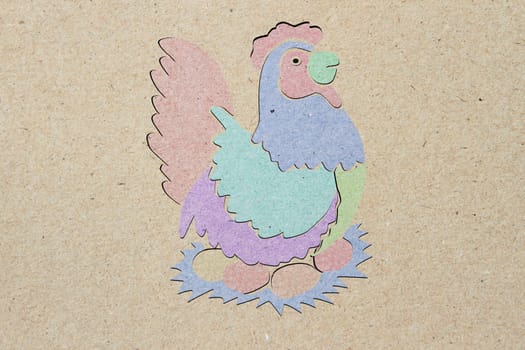 recycled paper craft stick, chicken, brown background.