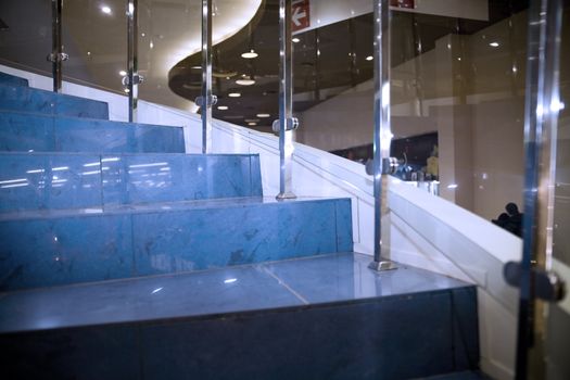 Blue marble steps in modern office building