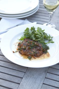 Chicken thigh, marinated and cooked on the barbecue