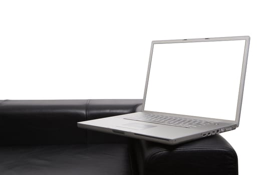 Laptop on modern couch isolated background and screen with clipping paths so you can insert your own items