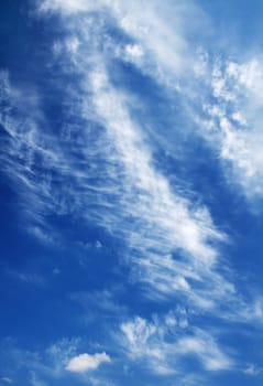 Blue cloudy sky on a warm sunny day
